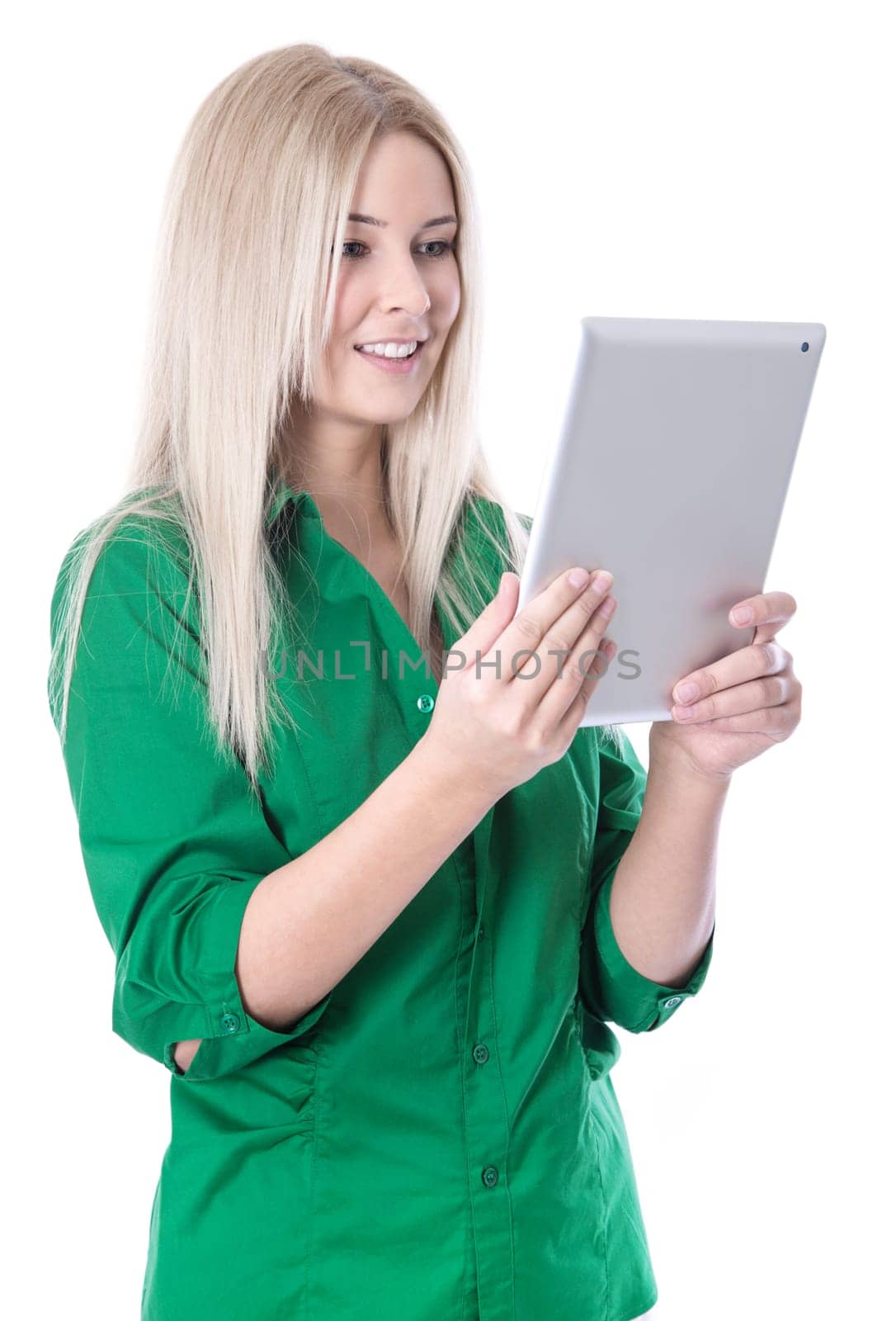 Young woman isolated in green blouse with tablet PC