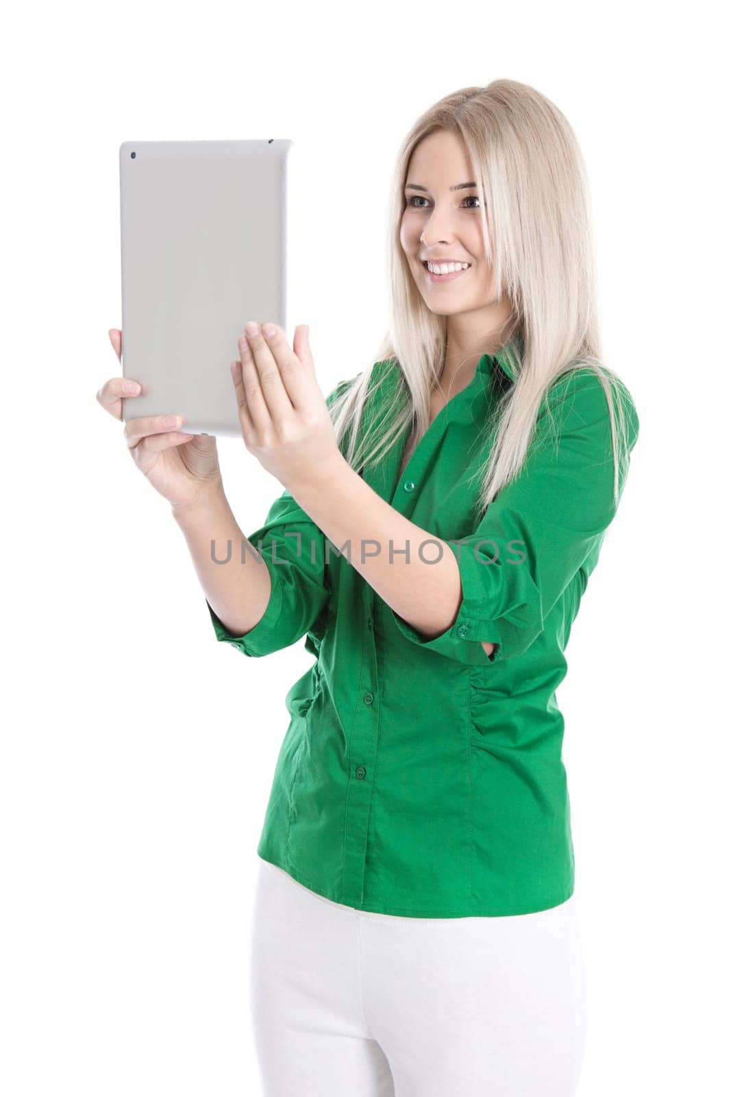 Young woman isolated in green blouse with tablet PC