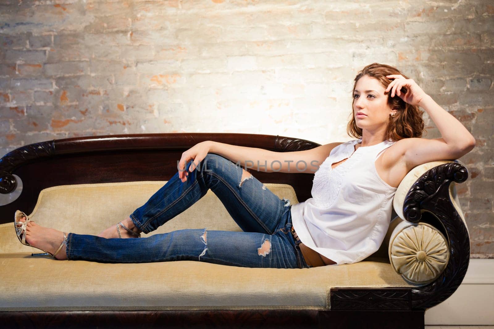 Portrait of a beautiful young woman relaxing on the couch