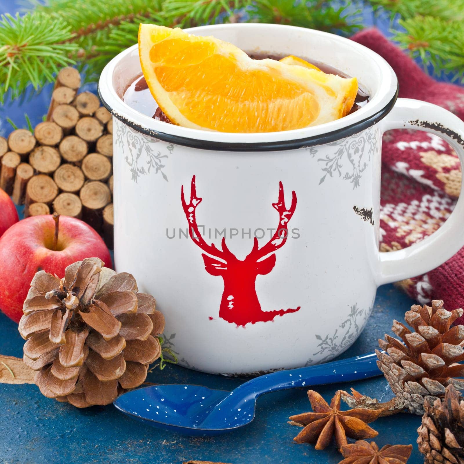 Hot punch with fresh oranges in winter