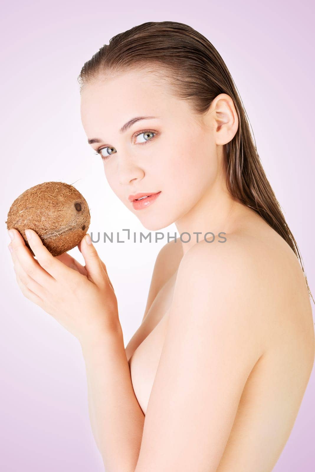 beautiful woman with coconut in hands