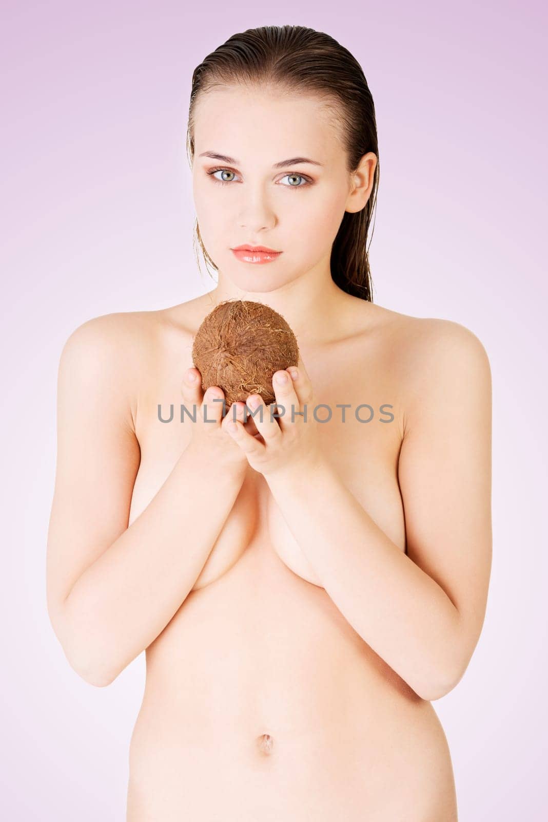 beautiful woman with coconut in hands