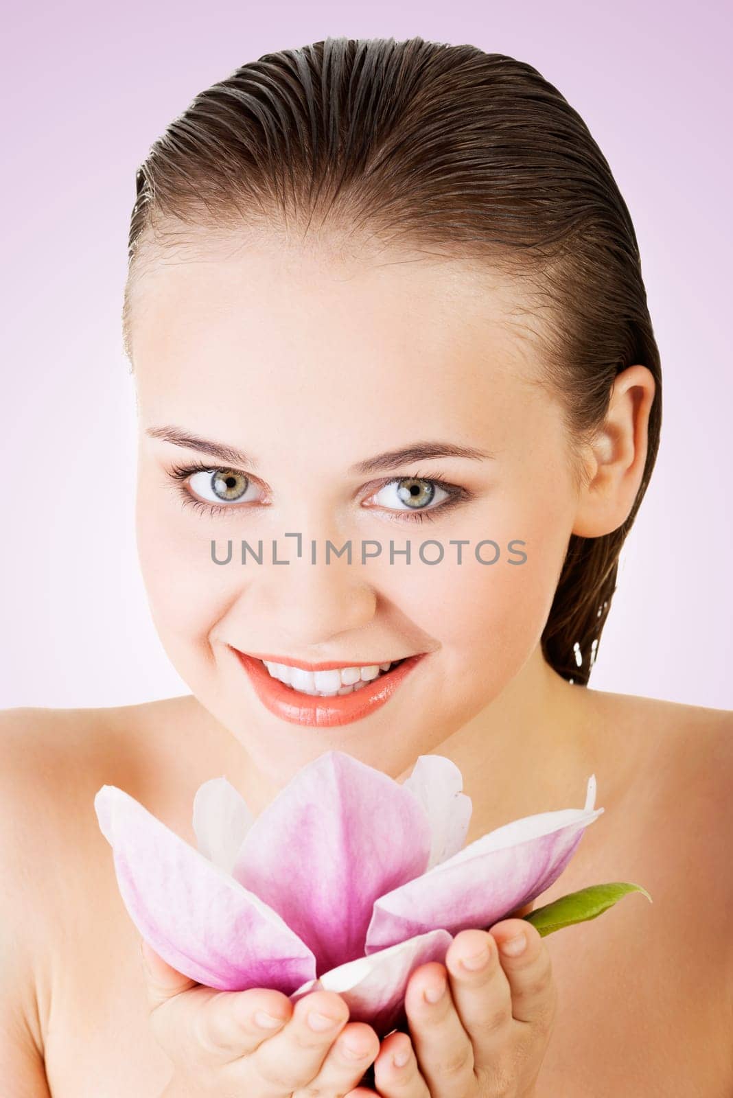 beauty face of the young beautiful woman with flower.