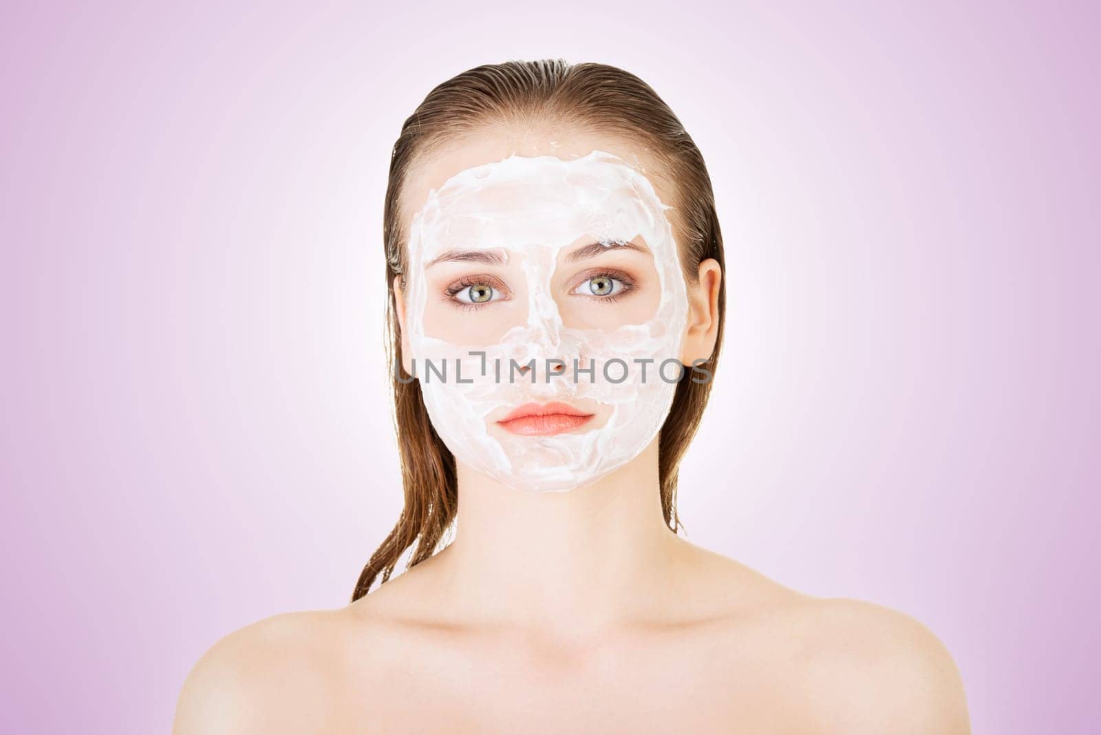 beautiful woman with clay facial mask