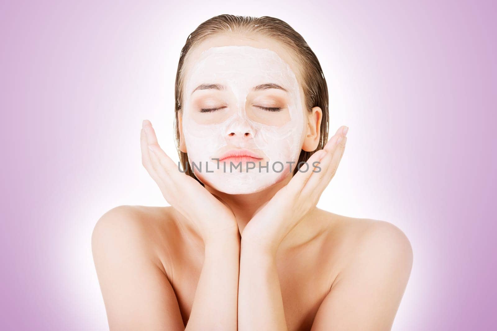 beautiful woman with clay facial mask