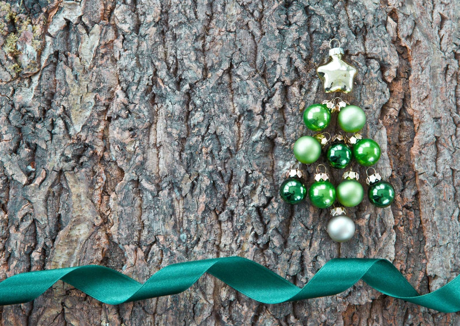 Rustic wooden background with colorful Christmas baubles for Christmas