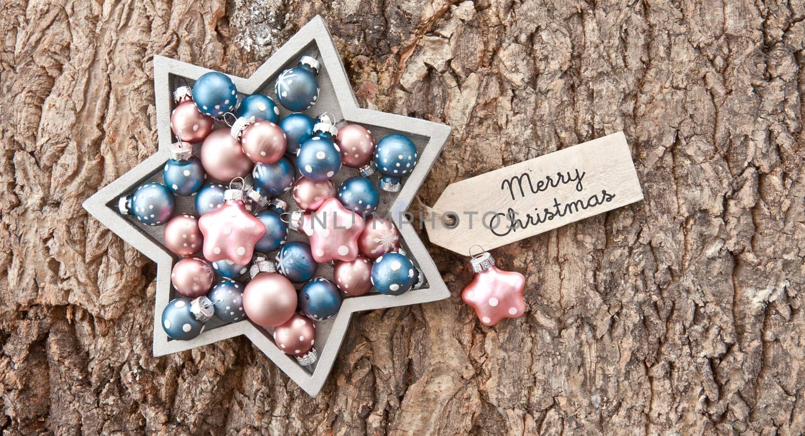 Rustic wooden background with colorful Christmas baubles for Christmas