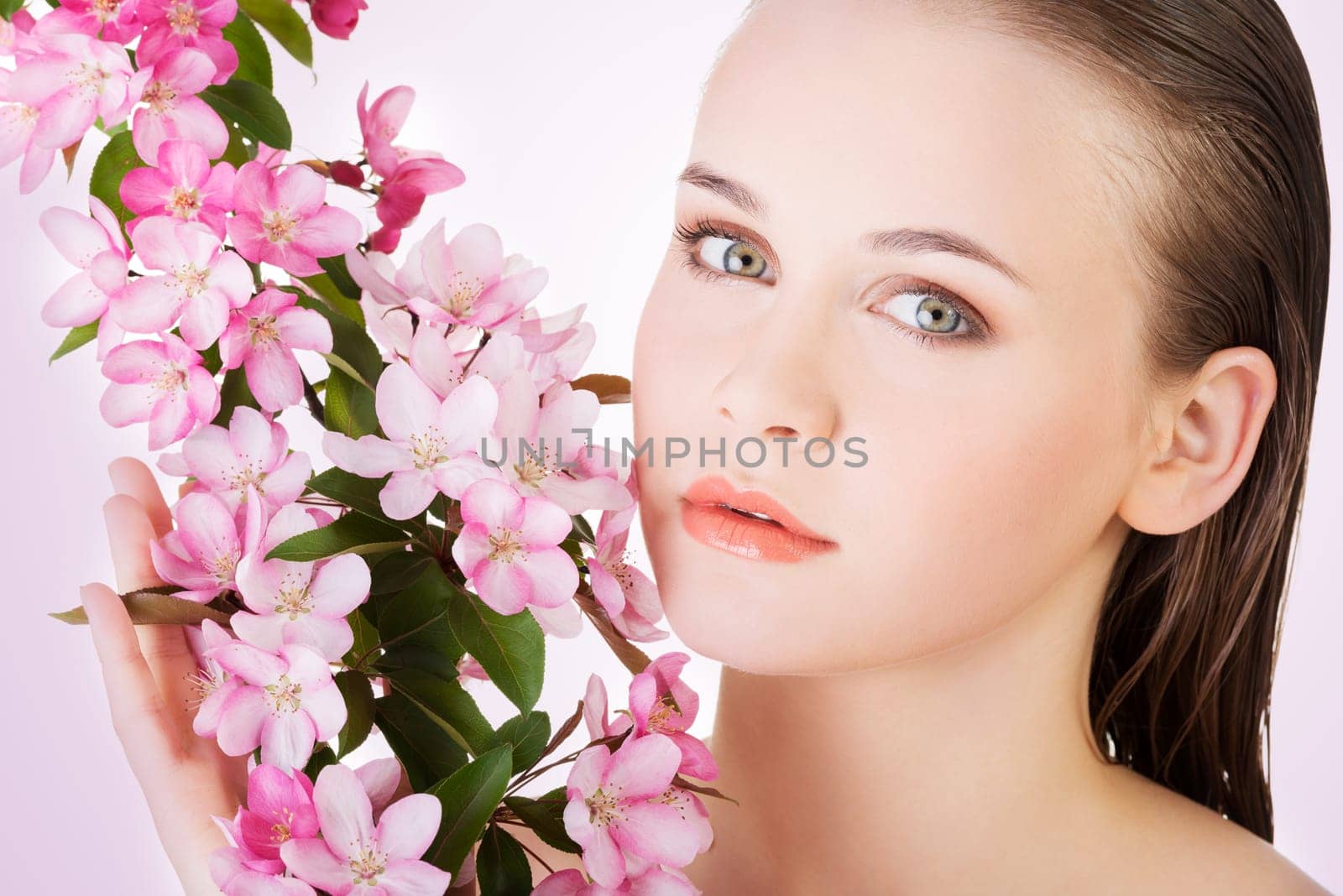 beauty face of the young beautiful woman with flower.
