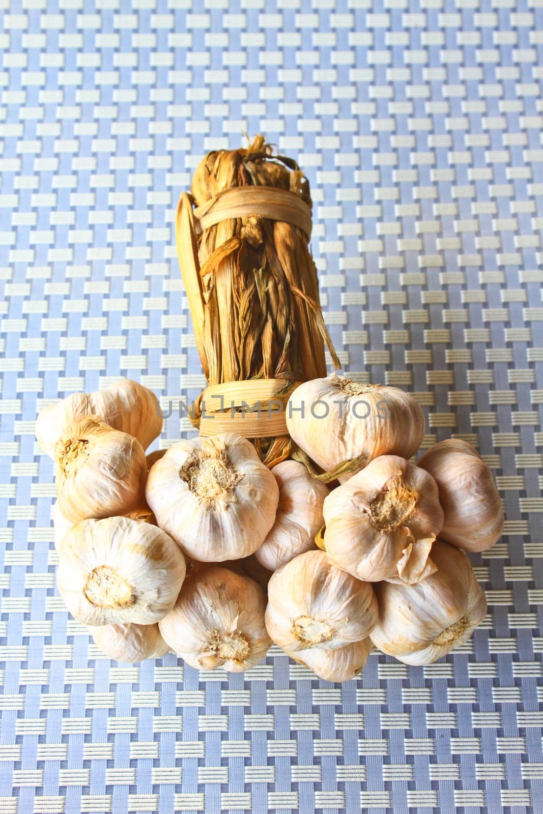 Bunch garlic isolated on background in kitchen