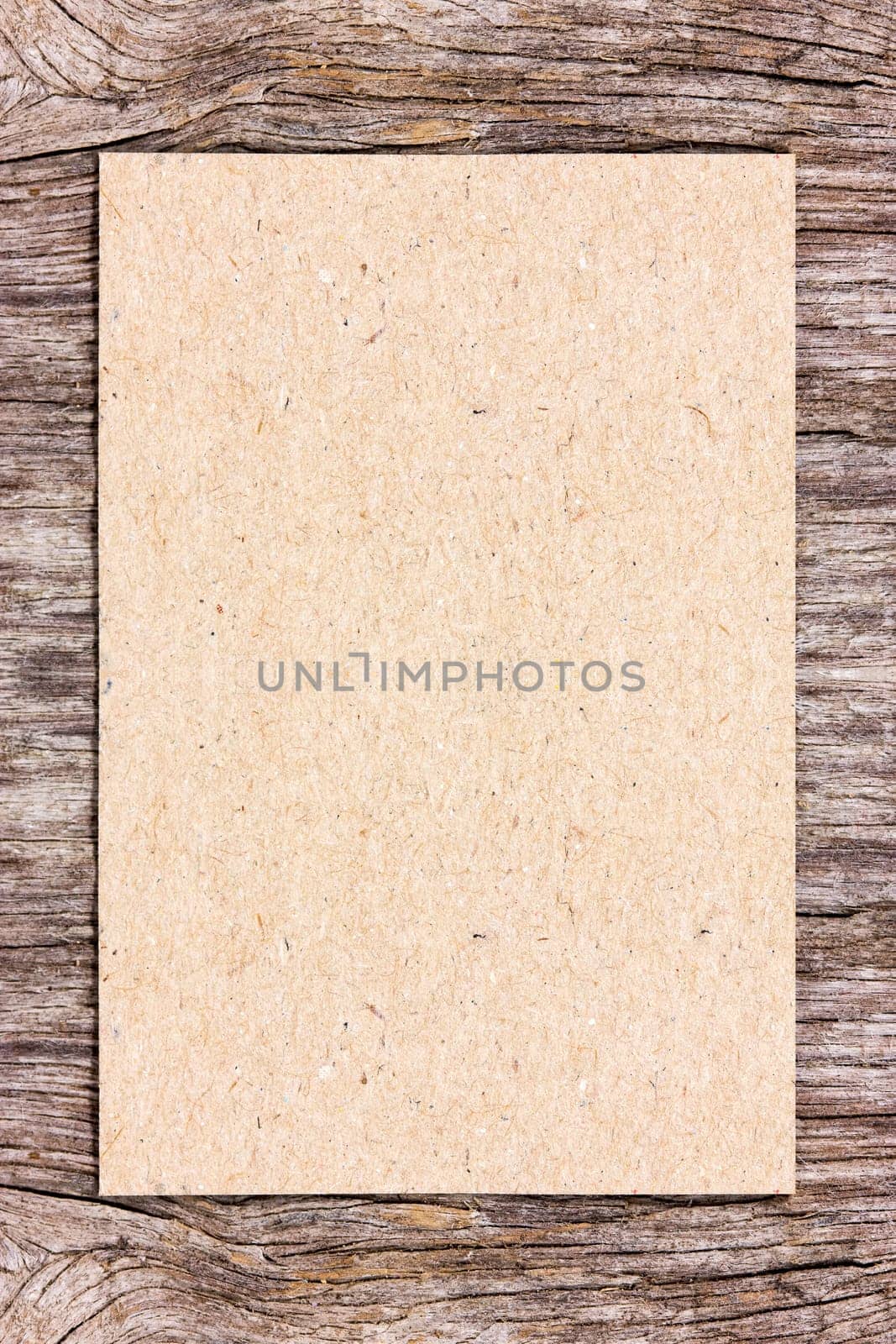 Recycle paper on wooden background. Can be used for your text