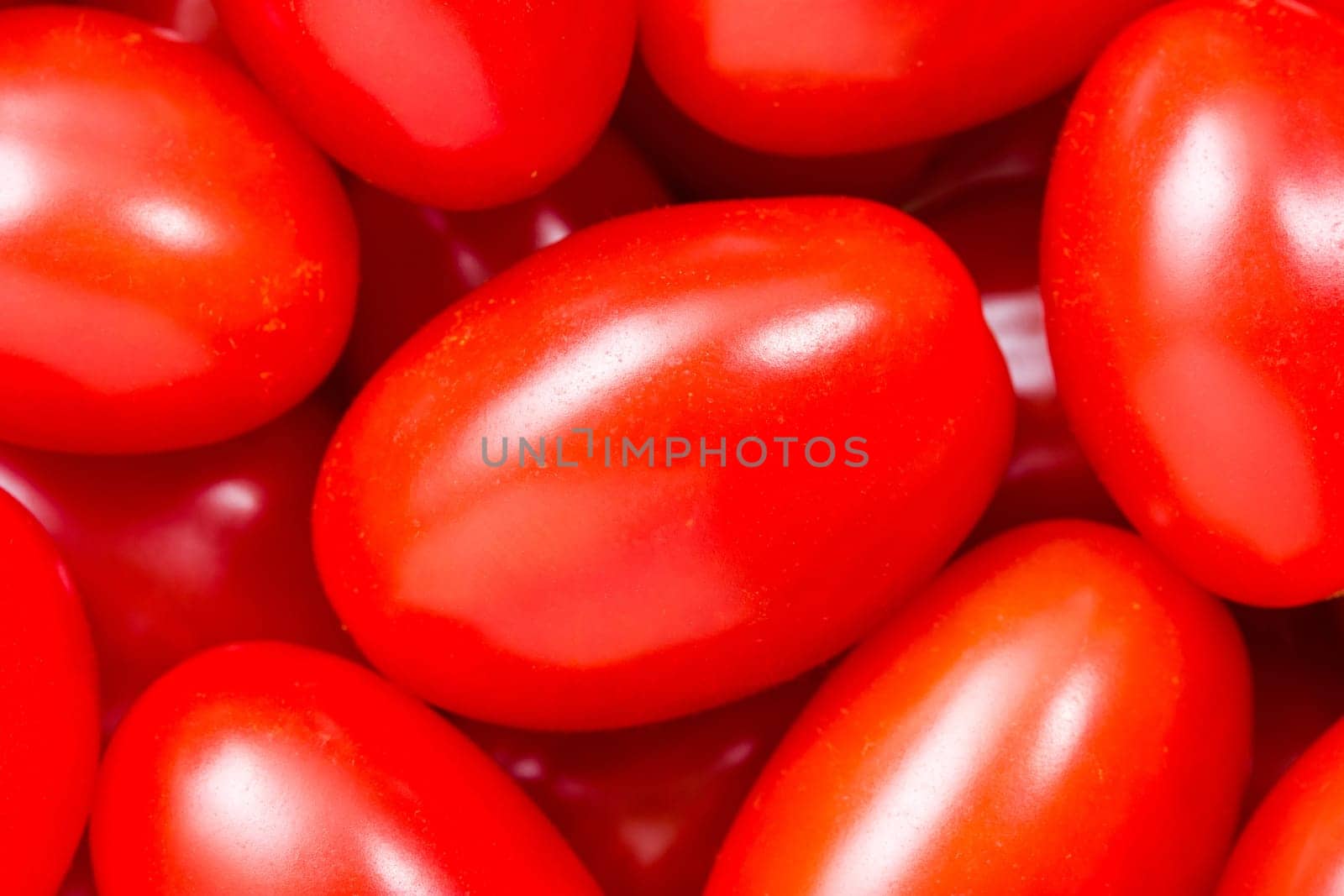 Many  ripe small tomatoes close up shot