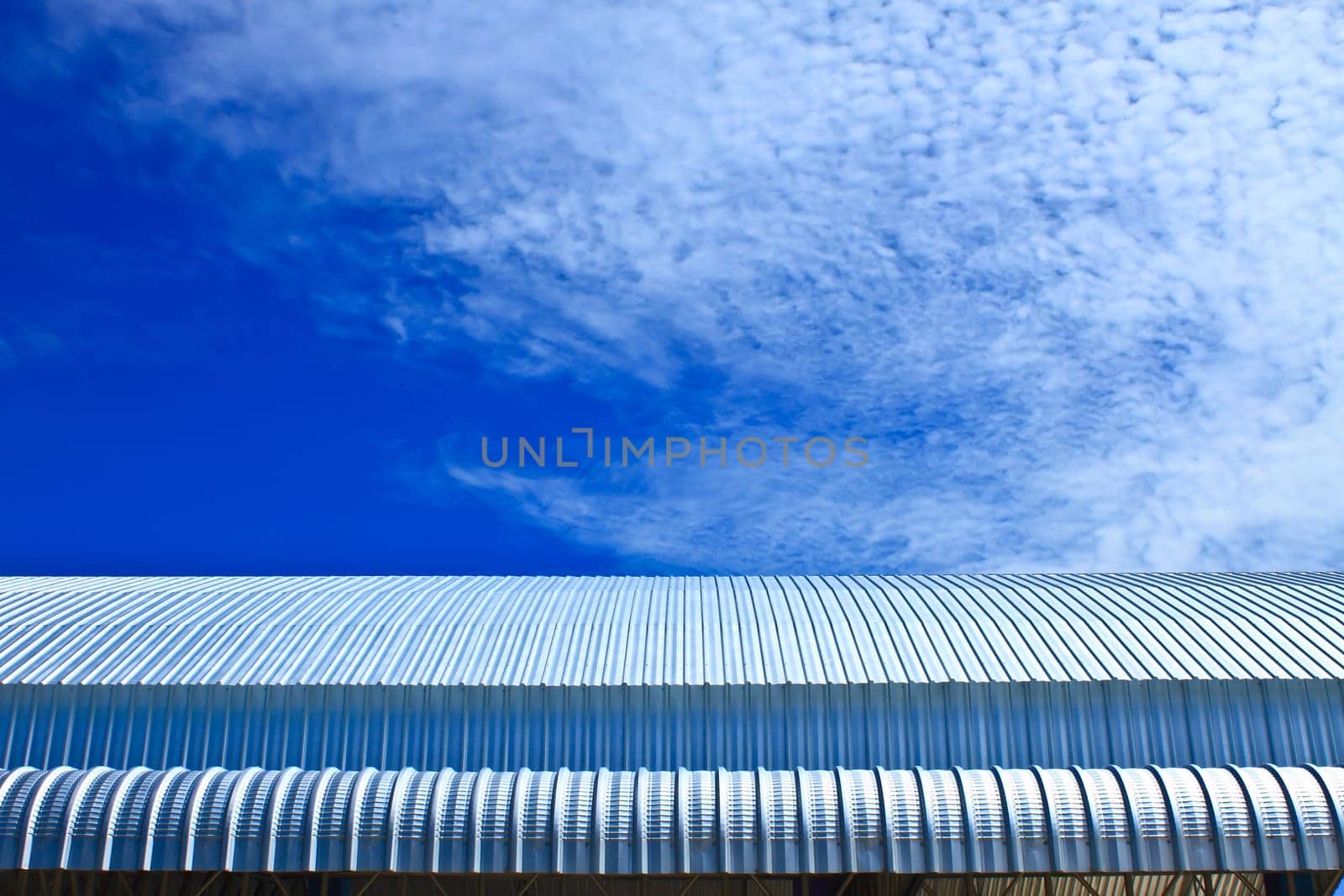 Metalic Facade, roof aluminium factory on blue sky