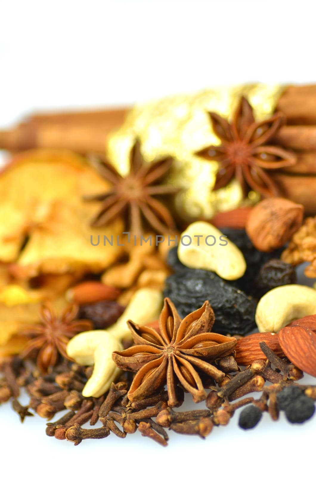 christmas spices, nuts and dried fruits isolated on white background