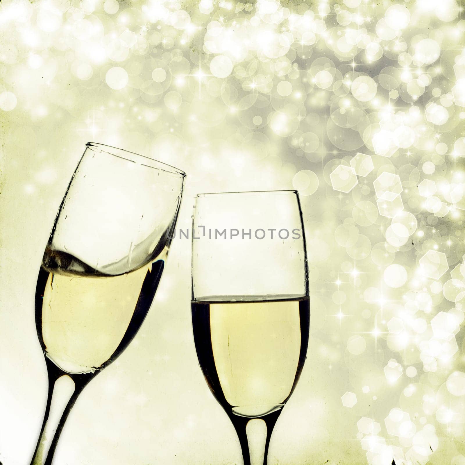 Vintage photo of glasses with champagne against holiday lights