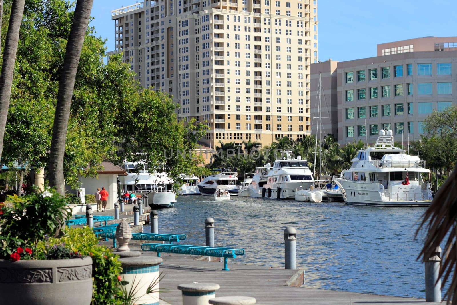 FORT LAUDERDALE, FLORIDA - FEBRUARY 3: People enjoying the Riverwalk Linear Park walkway and river with boats and beautiful views on a sunny day in downtown February 3, 2013 in Ft Lauderdale, Florida.