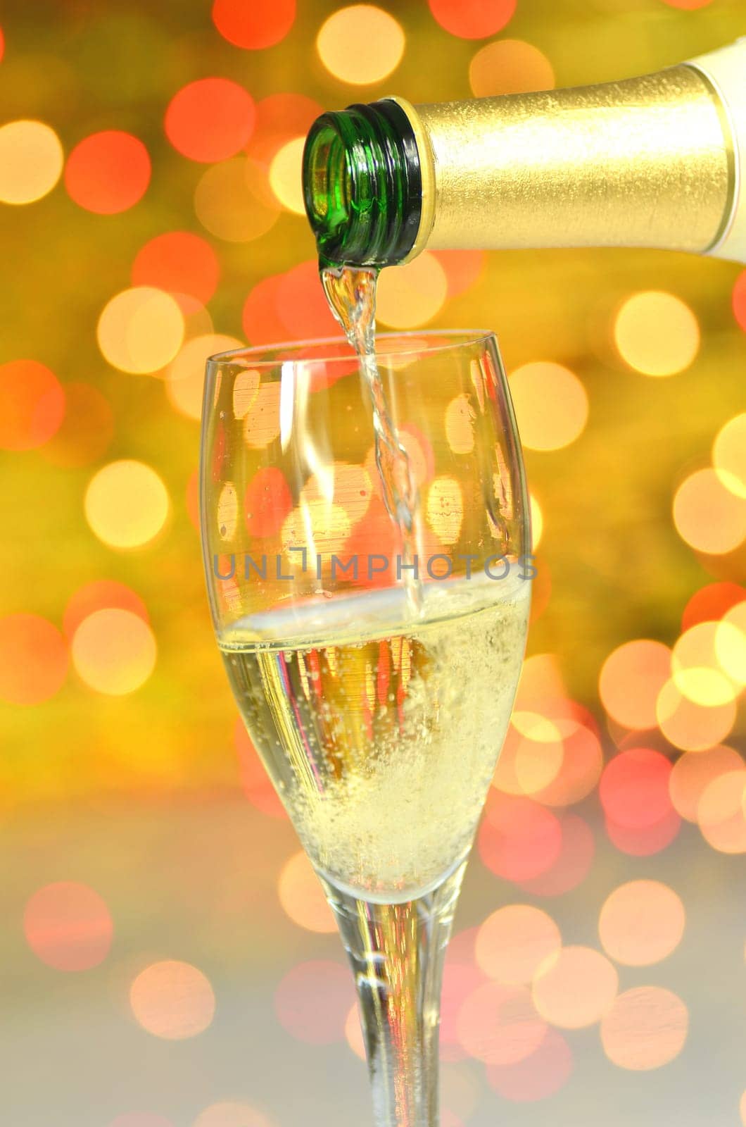 a glass of champagne against bokeh background