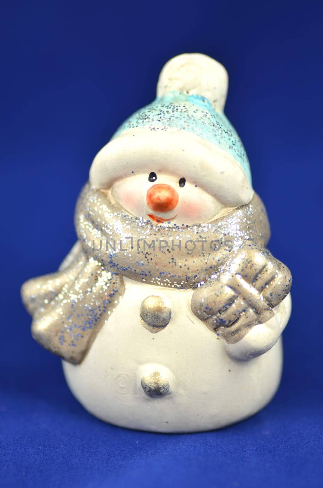 christmas decoration, figure of snowman on blue background