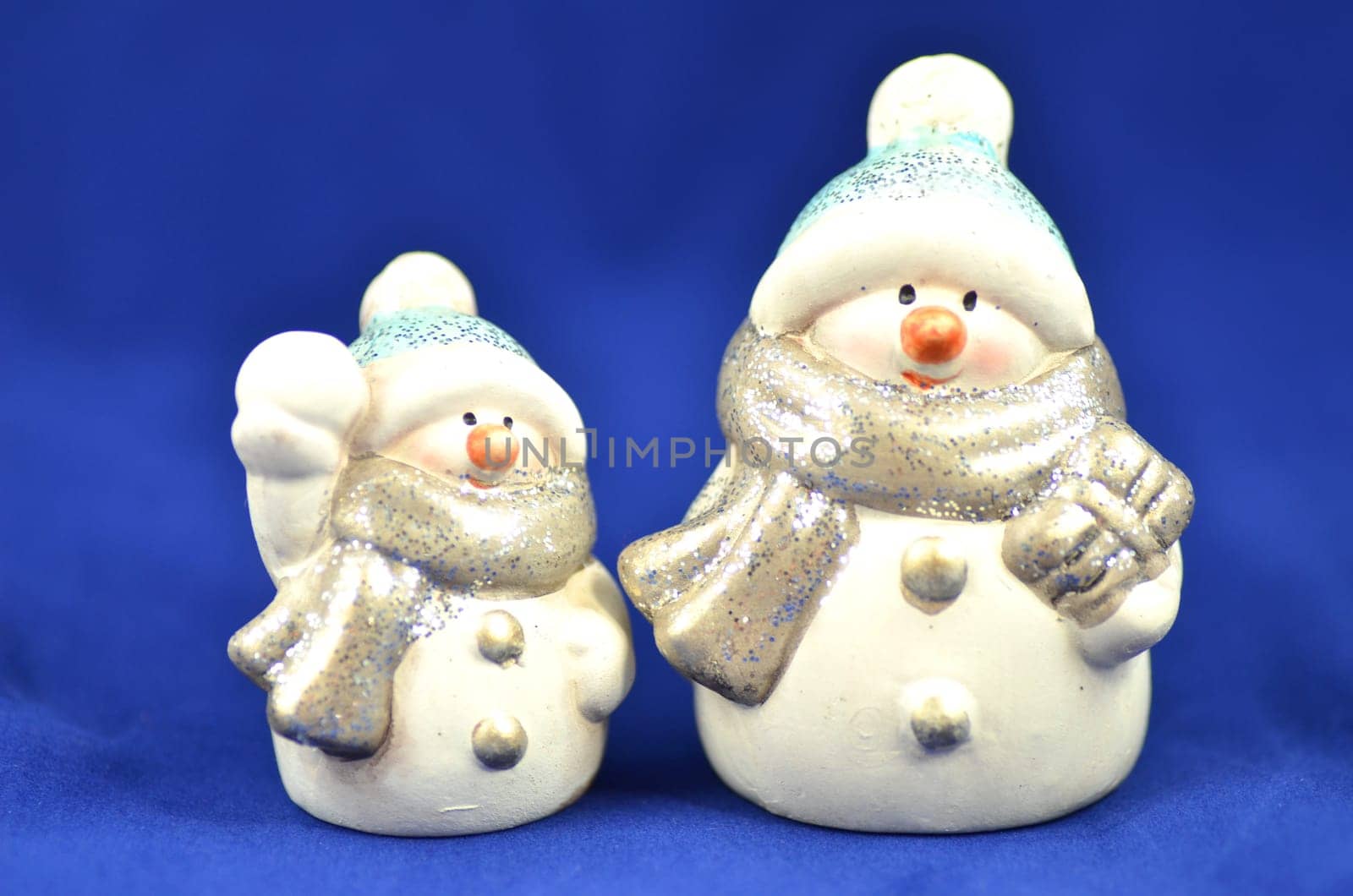 christmas decoration, two figures of snowman on blue background