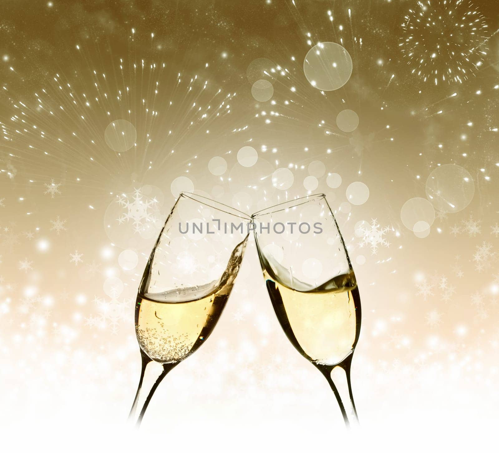 Glasses with champagne against fireworks