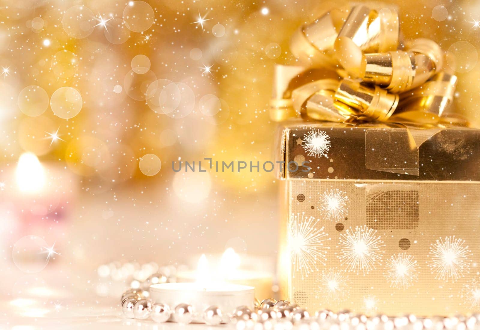 Gift box and candles and holiday lights