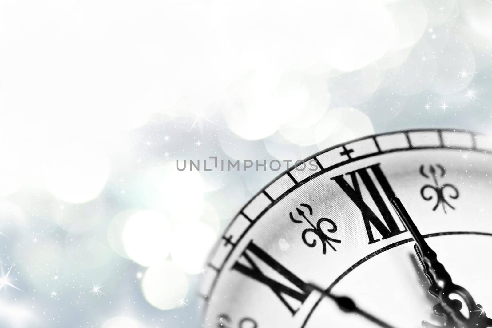 New Year's at midnight, clock on silver background