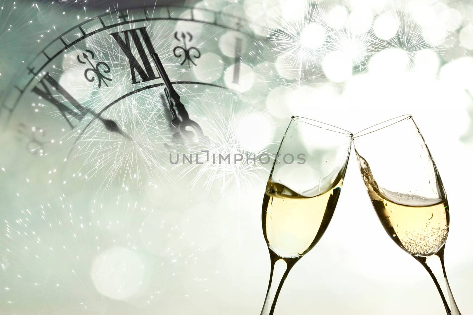 Glasses with champagne against fireworks and clock close to midnight