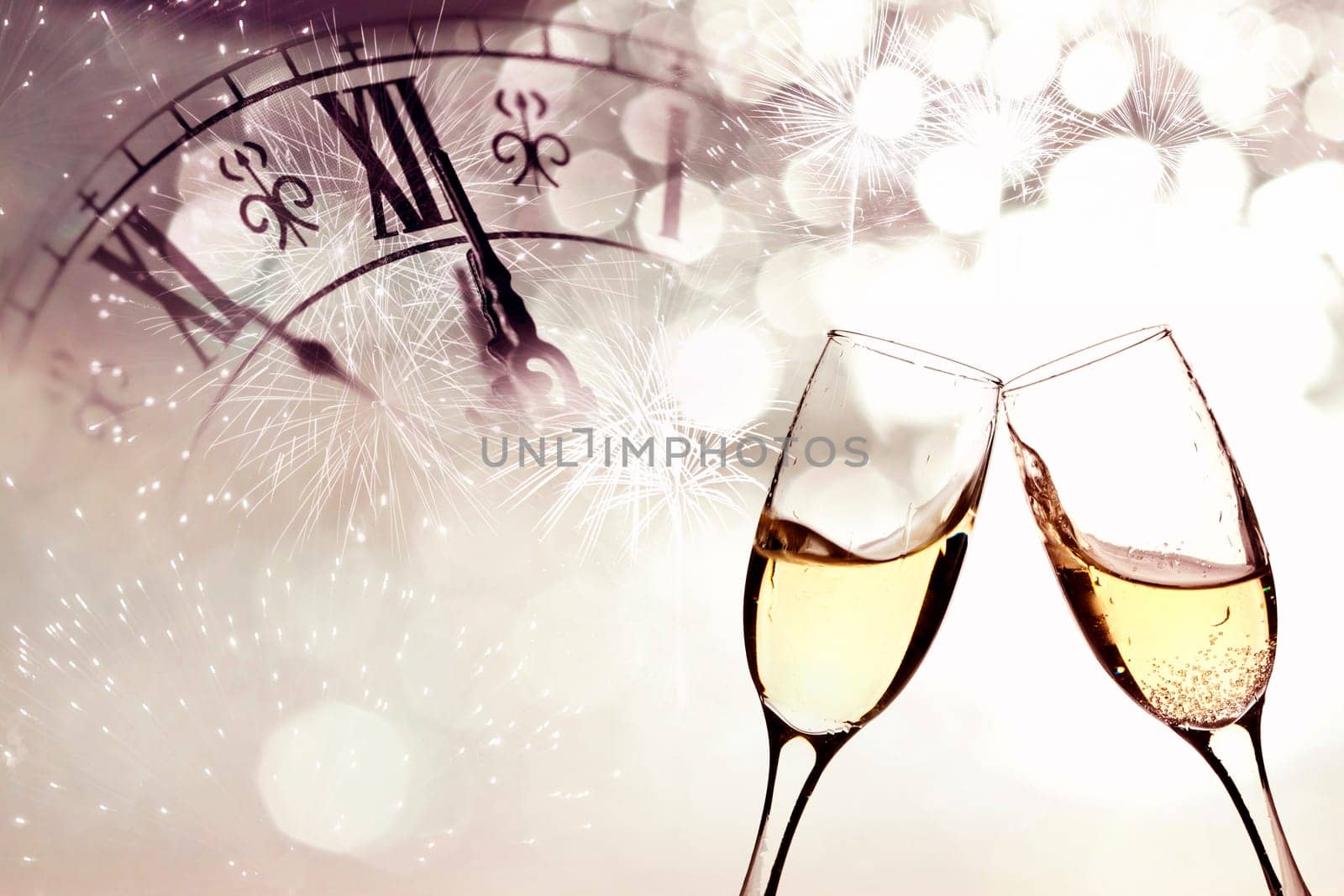 Glasses with champagne against fireworks and clock close to midnight