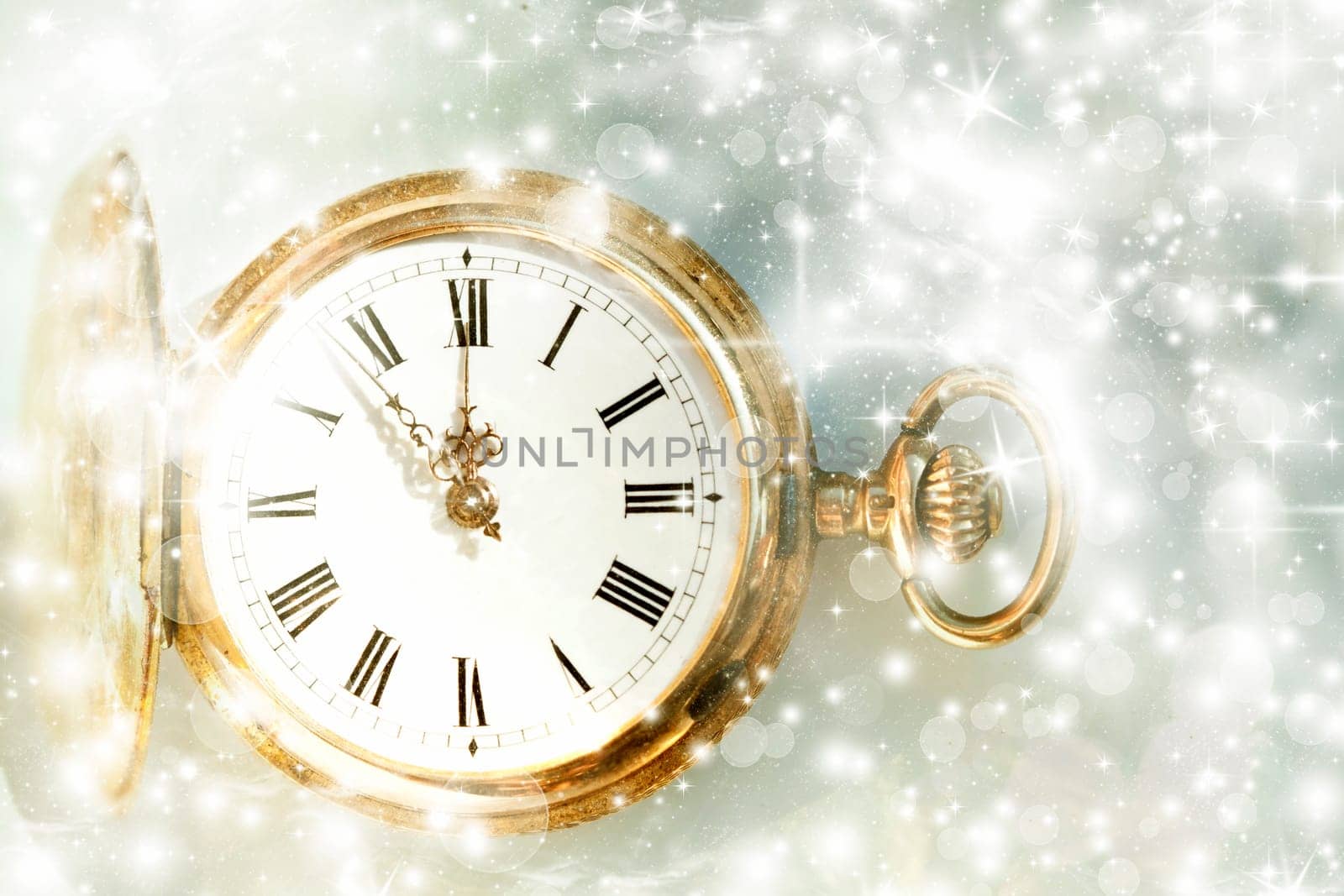 New Year's at midnight - Old golden clock with stars and snowflakes