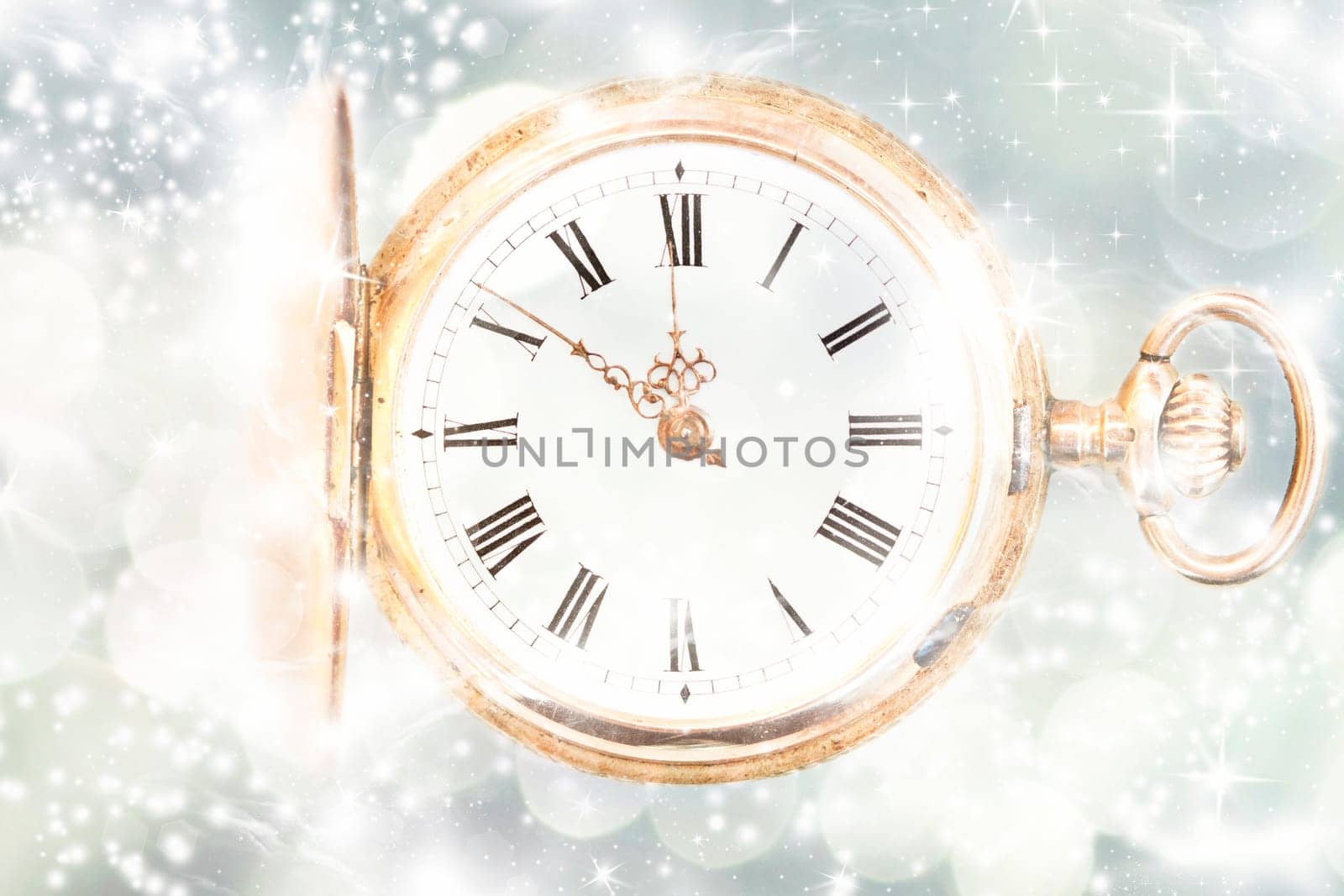 New Year's at midnight - Old golden clock with stars and snowflakes on the background
