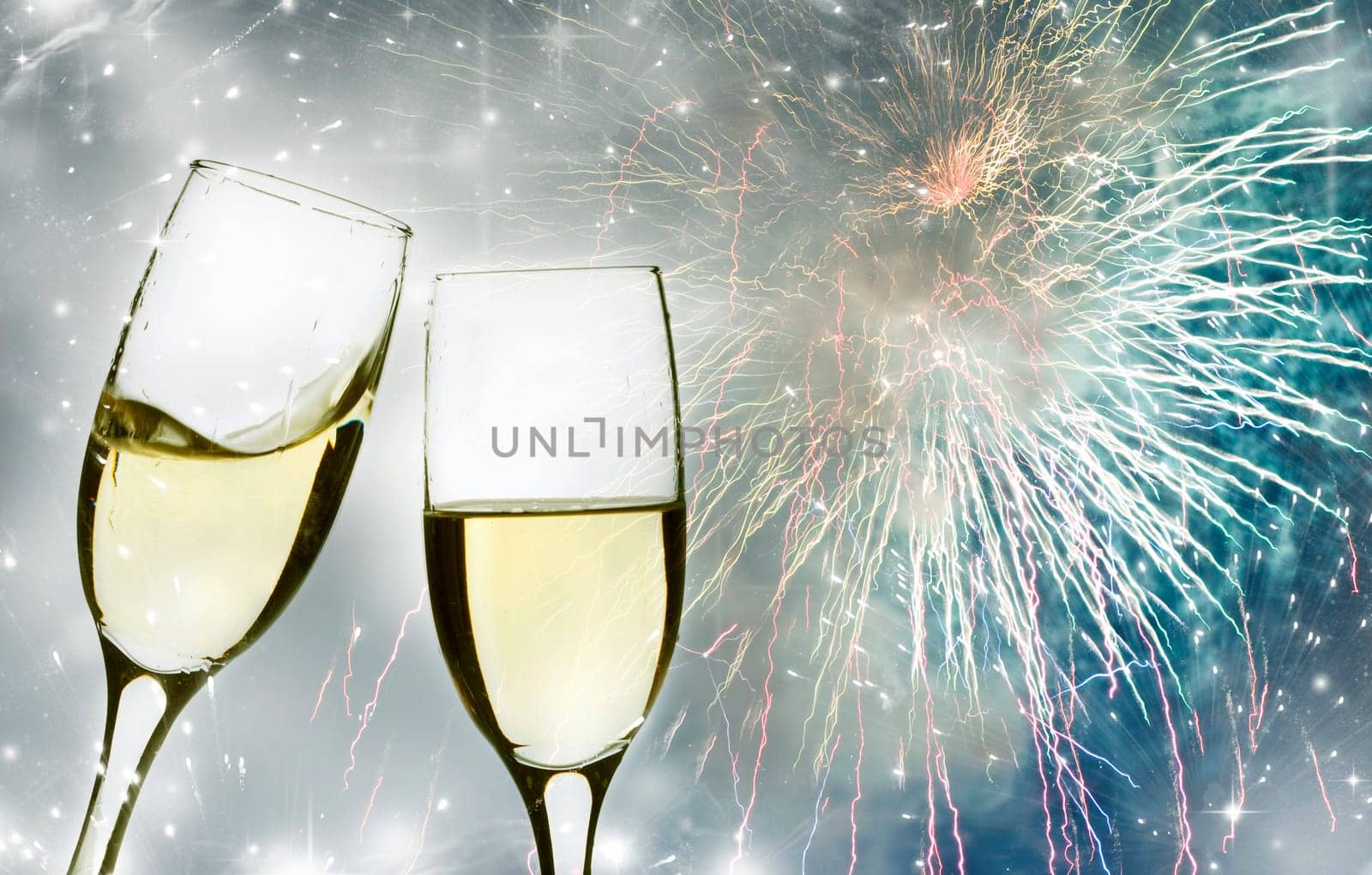 Glasses with champagne against fireworks and clock close to midnight