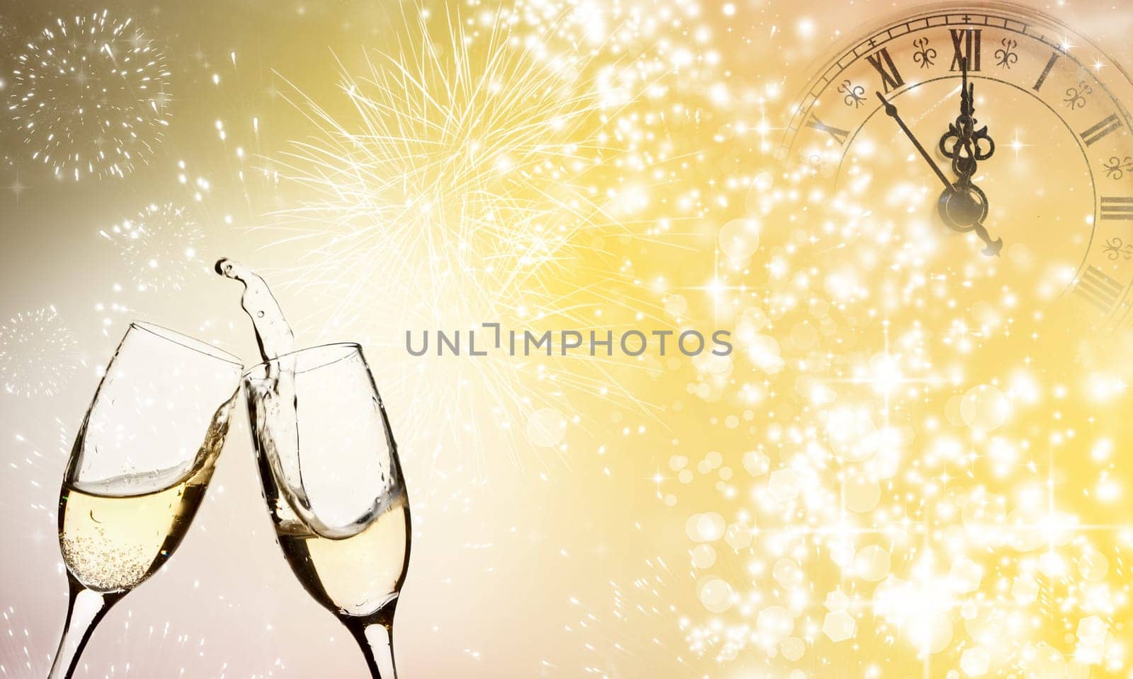 Glasses with champagne against fireworks close to midnight
