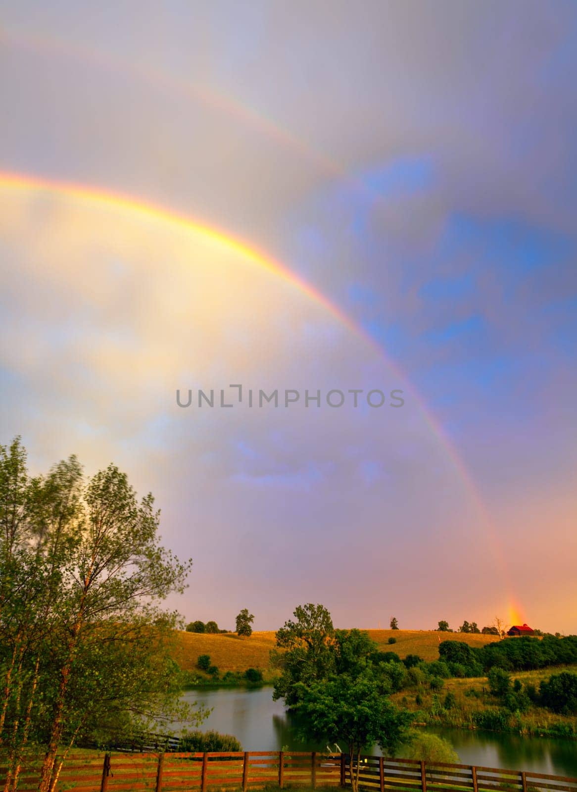 Scenic image of Kentucky farmland after the storm with double rainbow