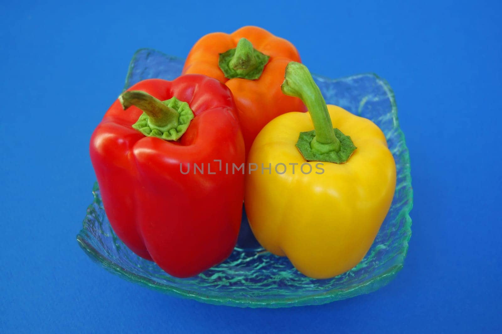 Red, orange and yellow peppers variety. Vegetables background.
