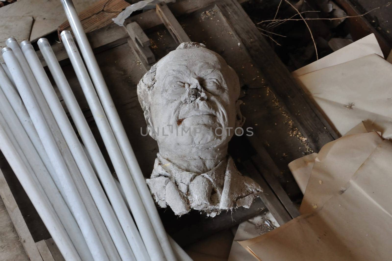 Broken sculpture head of adult man among debris in the abandoned studio of sculptor Nikolaos Pavlopoulos, Athens Greece, February 3, 2012.