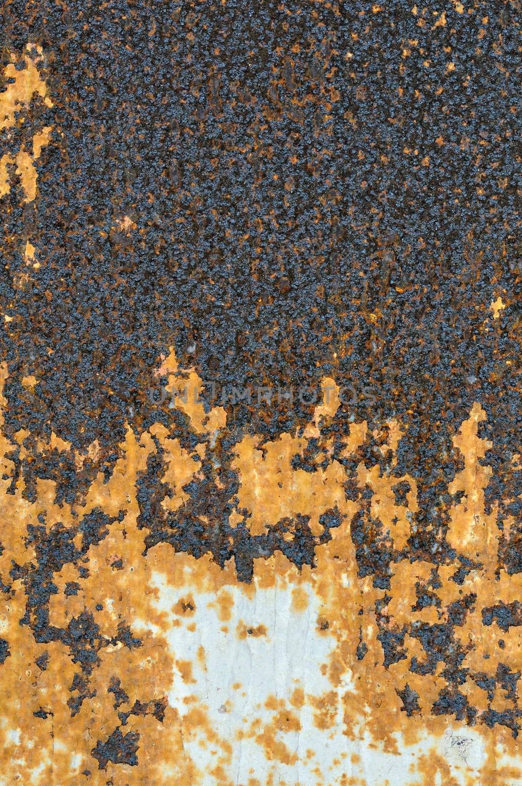Peeling paint rusty metal surface. Abstract industrial iron texture.