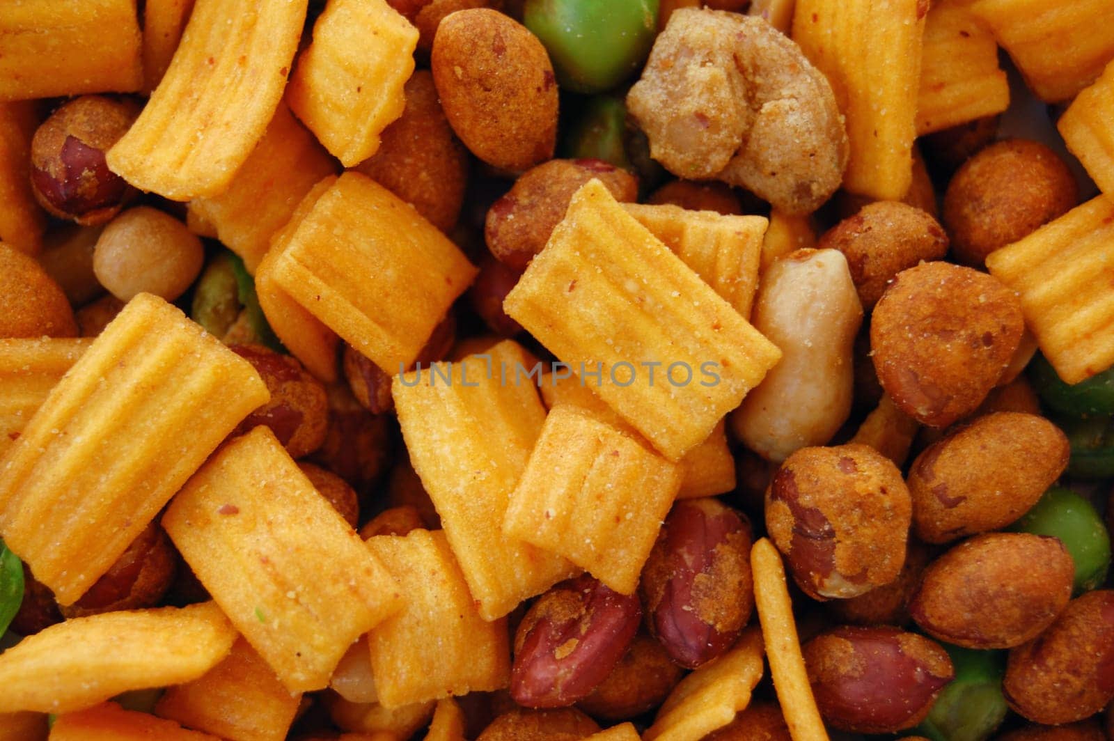 Spicy dried nuts salty snacks mix. Food background.