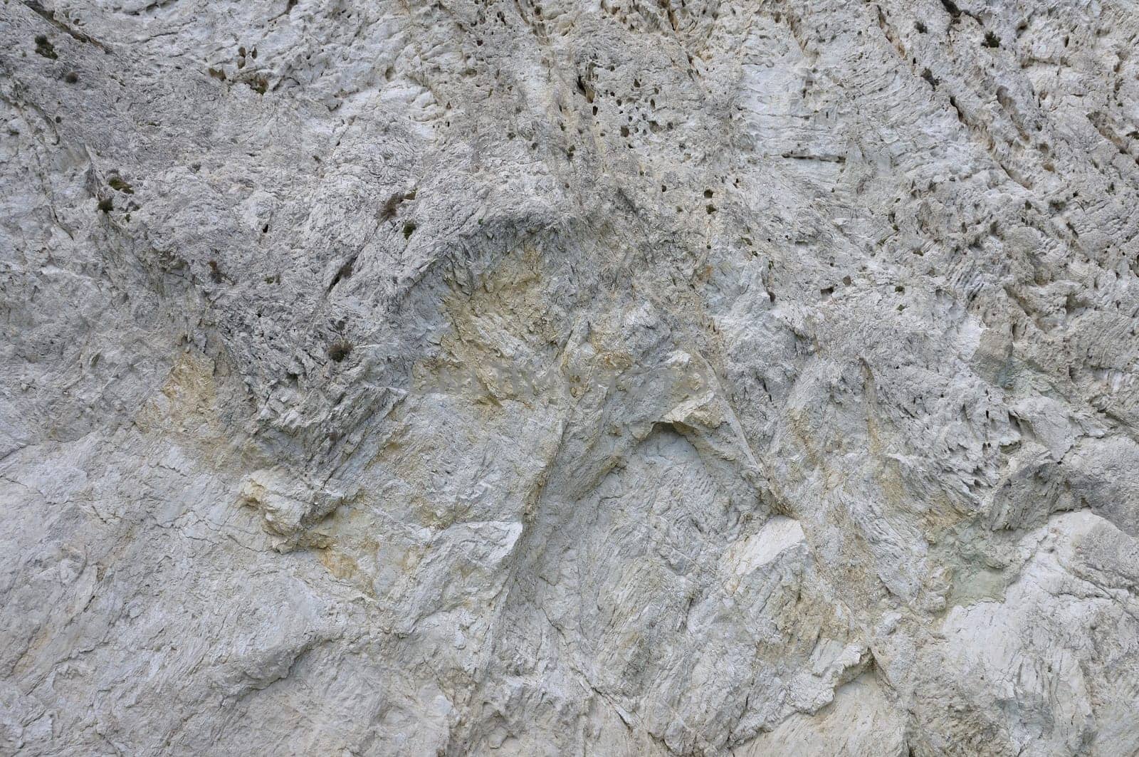 Steep mountain cliff rocky slope abstract stone background.