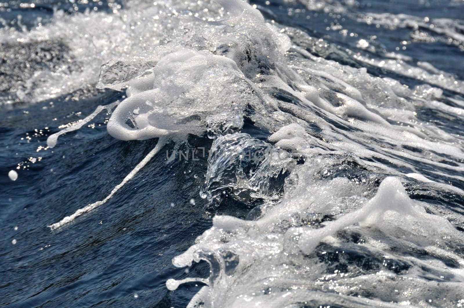 Sea waves abstract nature splashing water background.