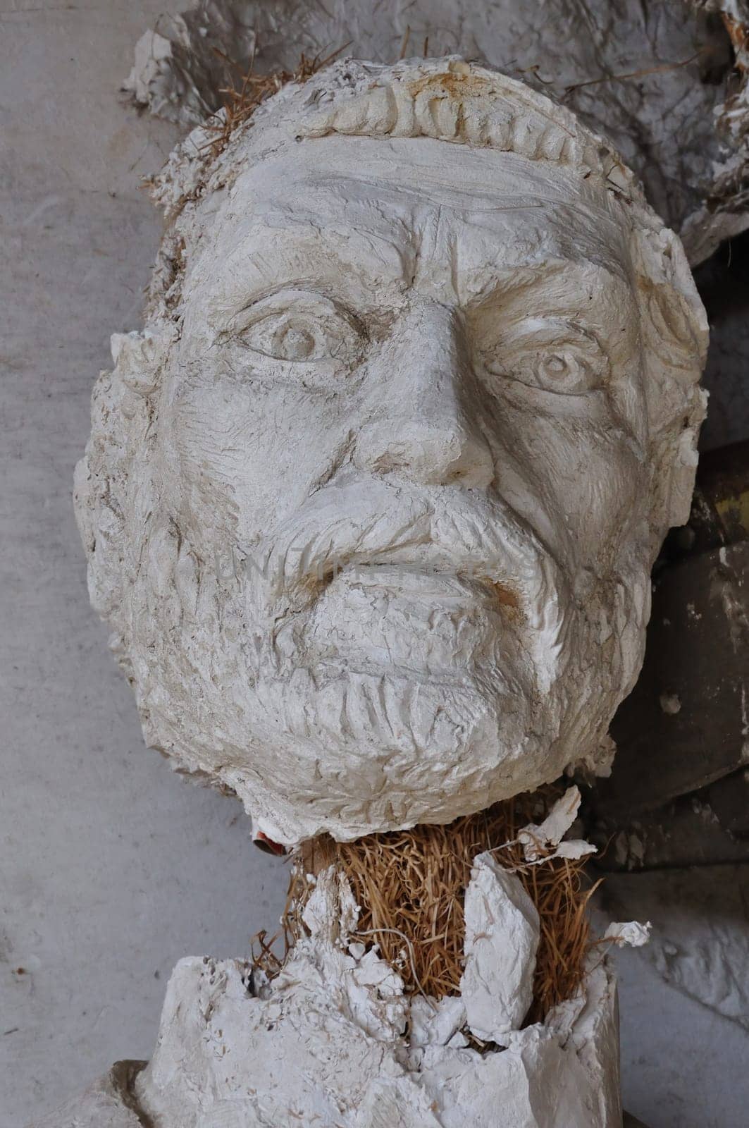 Plaster sculpture ancient god Zeus broken statue head in the abandoned studio of sculptor Nikolaos Pavlopoulos in Athens Greece, February 3, 2012.