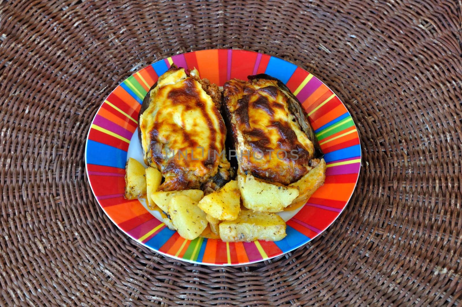 Eggplants stuffed with ground beef and bechamel white sauce. Greek food papoutsakia.