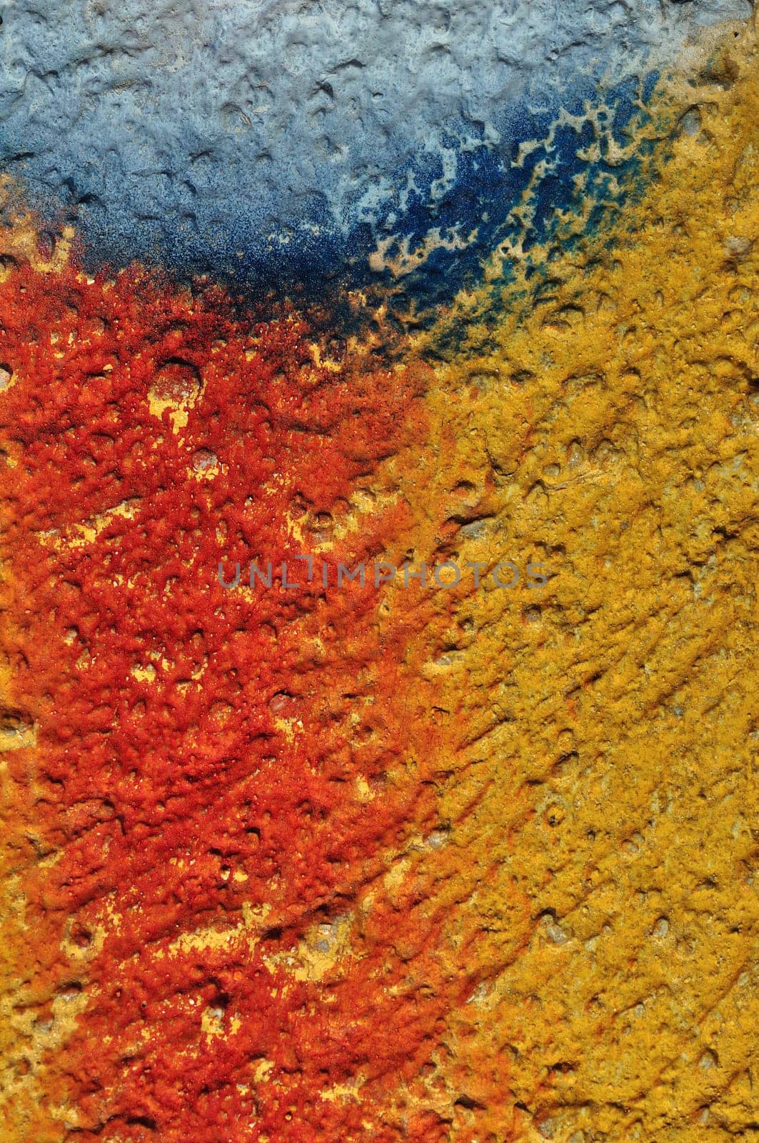 Paint smudged textured plaster and gravel wall abstract background.