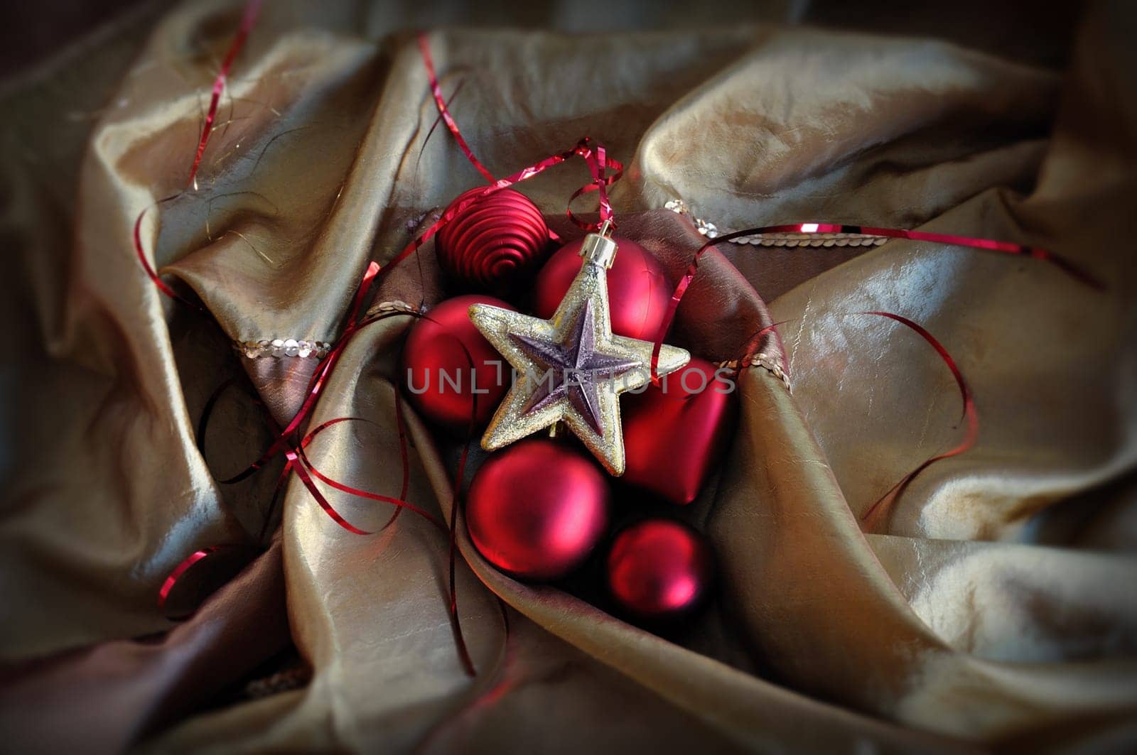 Red baubles and golden star. Christmas ornaments background.