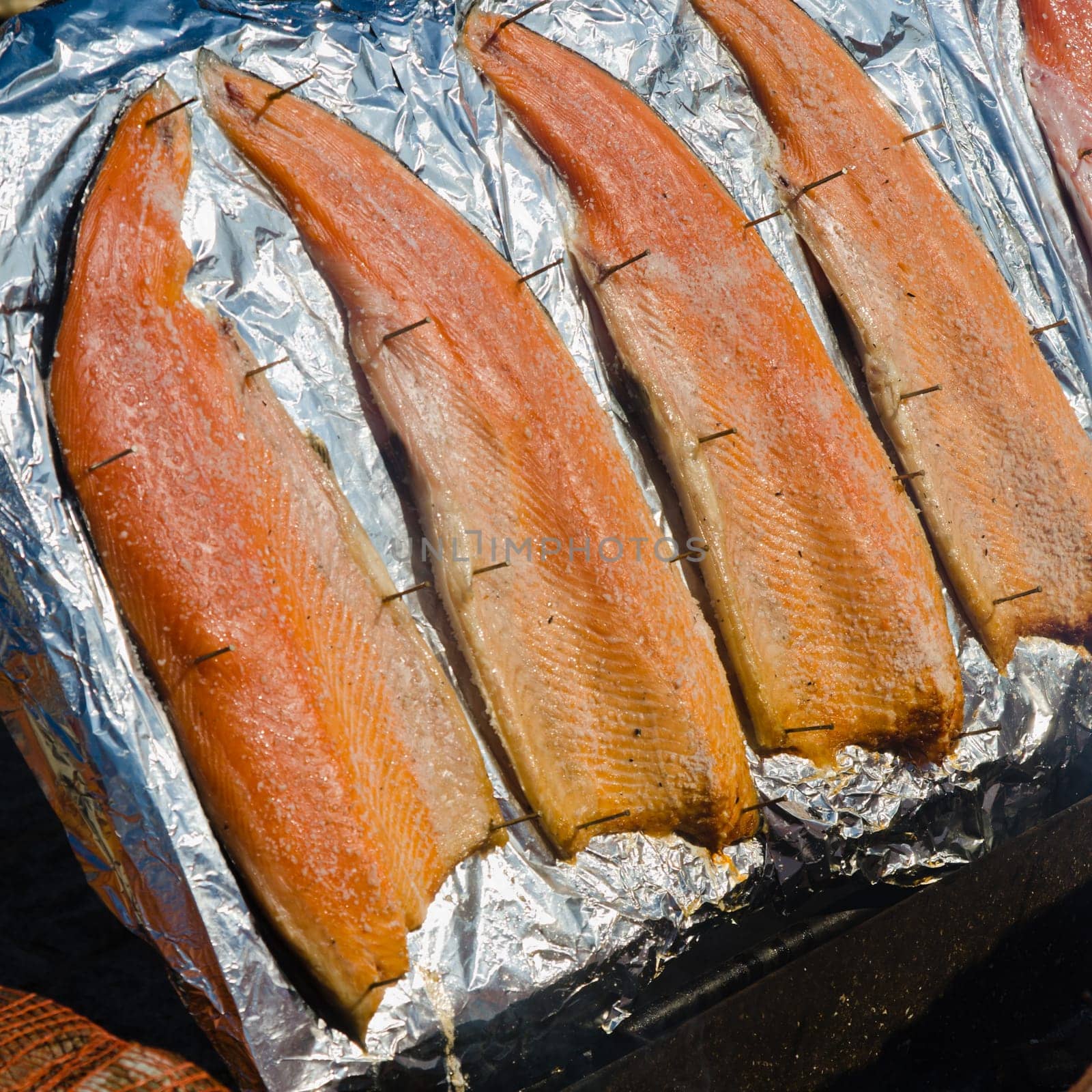 salmon fillet roasted on coals, close-up