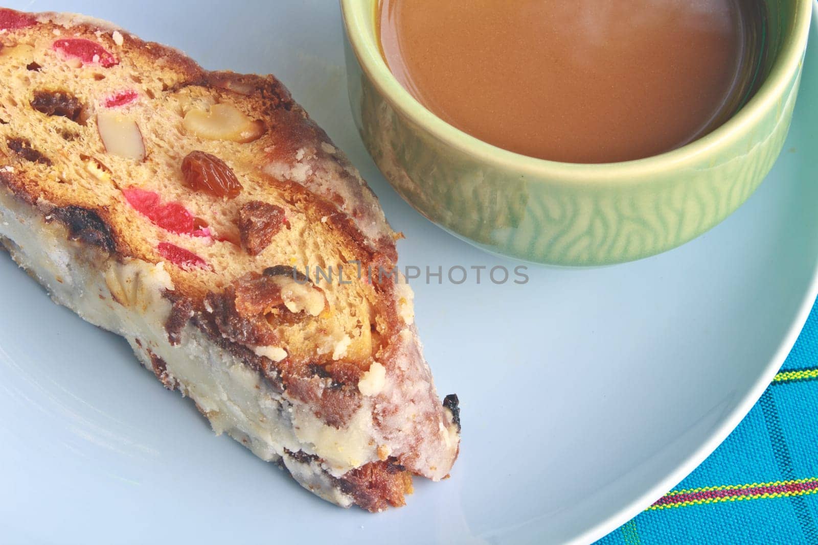 Fruitcake with raisin and Seasoning on table, with hot coffee
