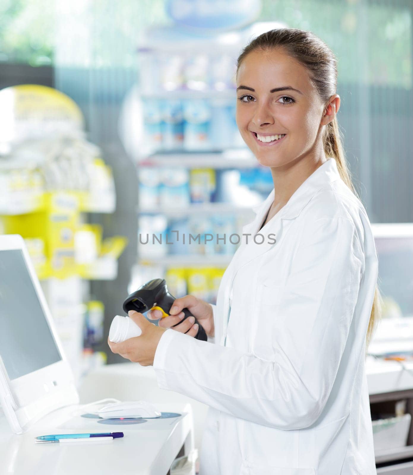 Portrait of a smiling female pharmacist at pharmacy
