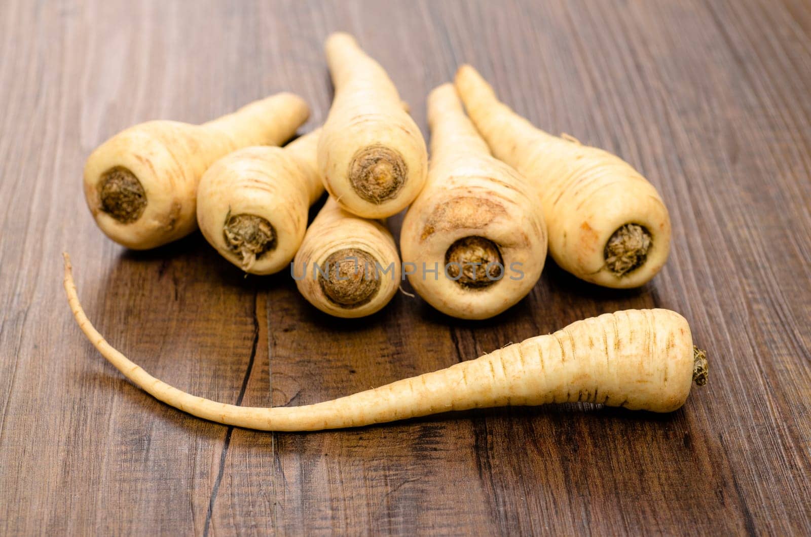 A stack of vegetable parsnips on a table