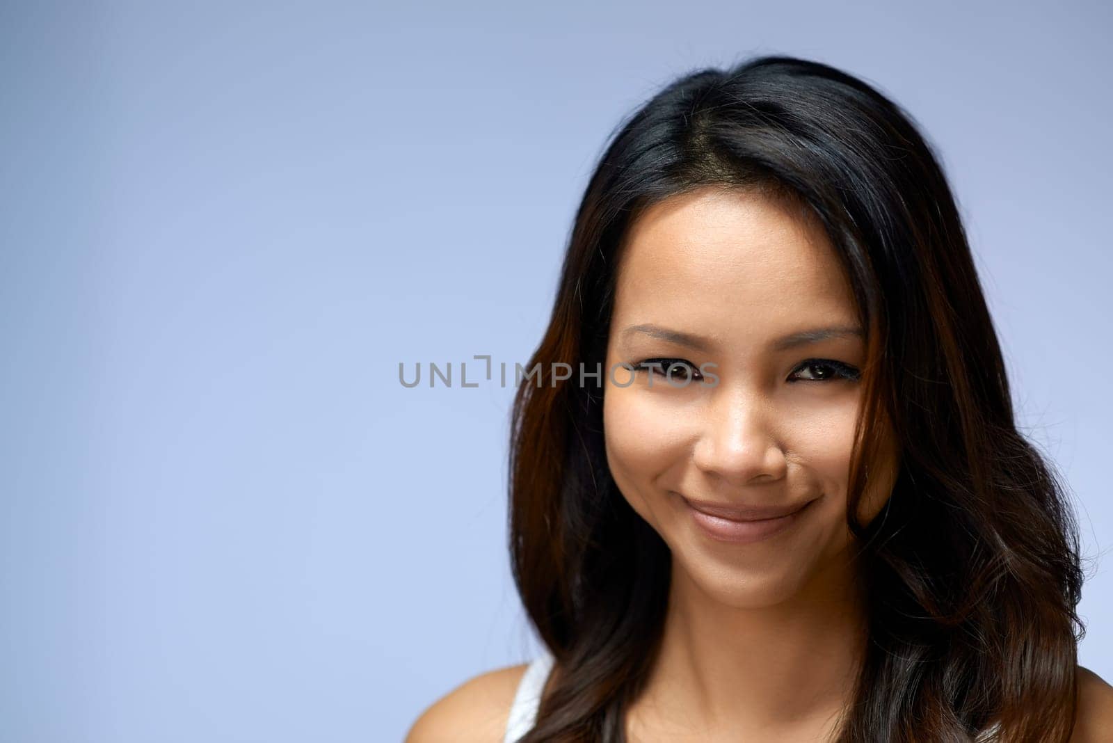Young people, female teenager, woman, beauty and body care, portrait of happy Asian girl smiling in studio on gray background, copy space