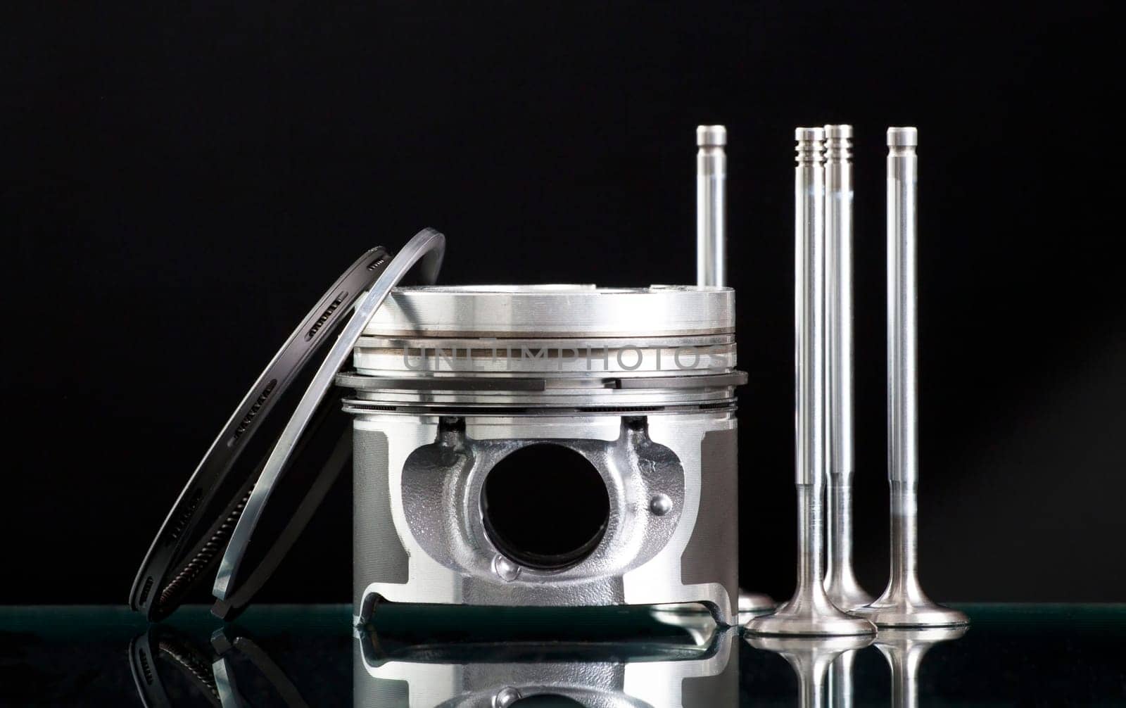 Pistons and accessories isolated on black background