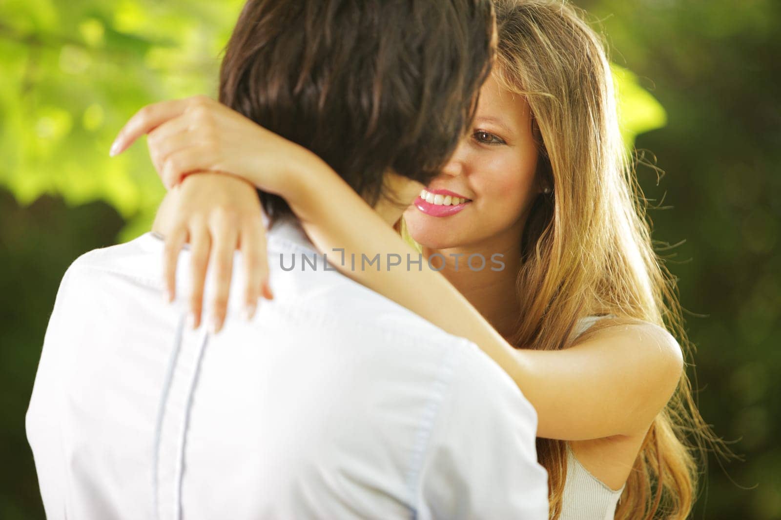 a young couple in love having a romantic moment in the park