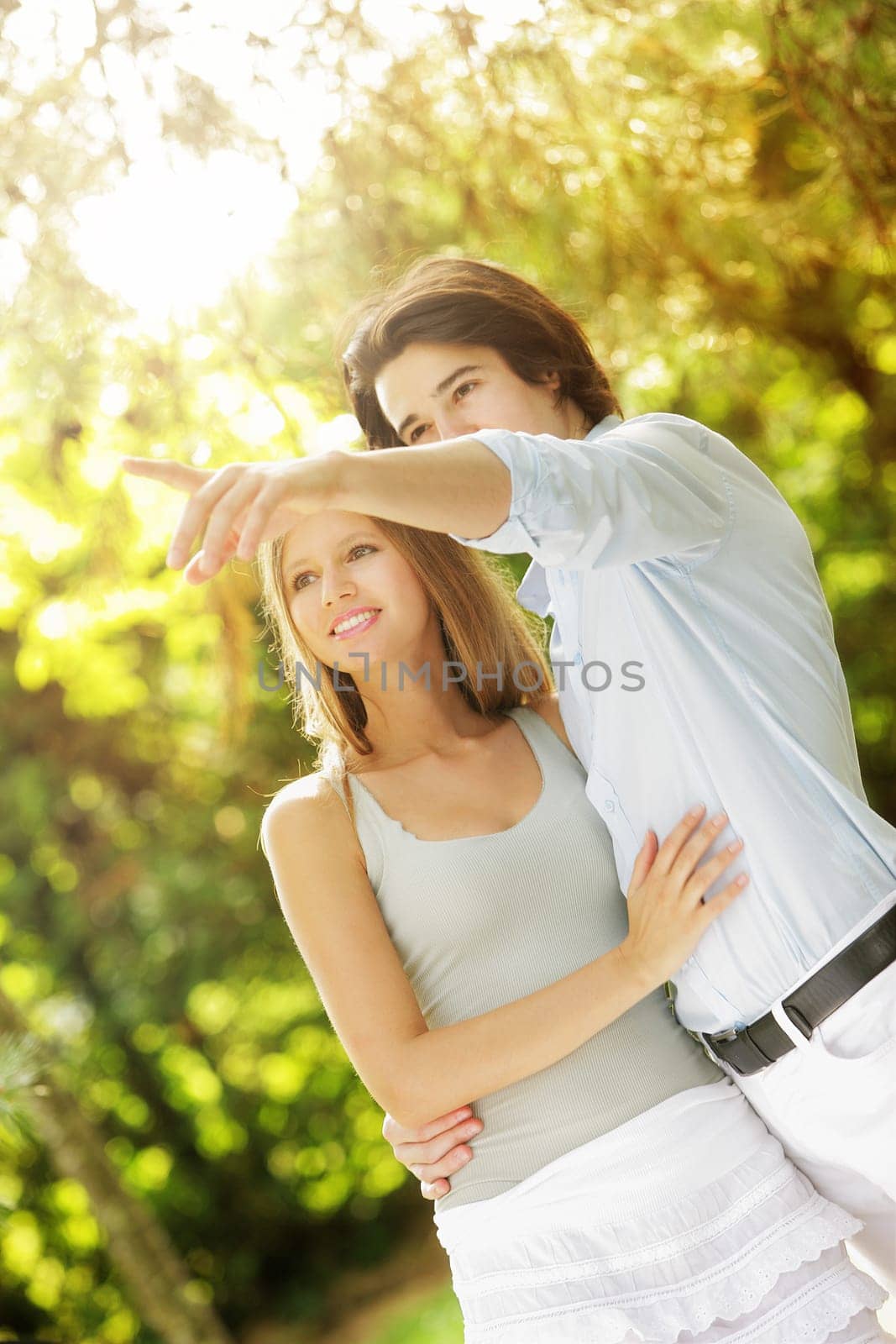a young couple in love walking in the park